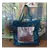 Filippo, sac cabas cuir bleu canard et poche mordorée, de face